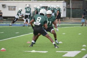 REECE NAGAOKA / RNAGAOKA@STARADVERTISER.COM
                                UH cornerback Billy Mitchell III, back, worked on a tackling drill with Jojo Forest during a practice on July 30.