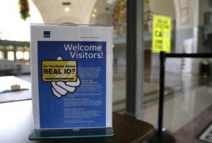 ASSOCIATED PRESS
                                In this file photo, a sign at the federal courthouse in Tacoma, Wash., is shown to inform visitors of the federal government’s REAL ID act, which requires state driver’s licenses and ID cards to have security enhancements and be issued to people who can prove they’re legally in the United States.
