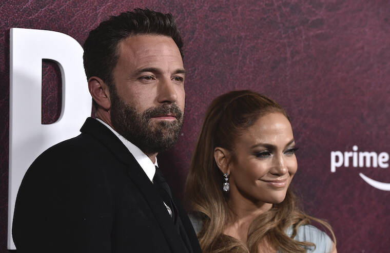 JORDAN STRAUSS/INVISION/AP / 2021
                                Ben Affleck, left, and Jennifer Lopez arrive at the premiere of “The Tender Bar” at the TCL Chinese Theatre in Los Angeles.