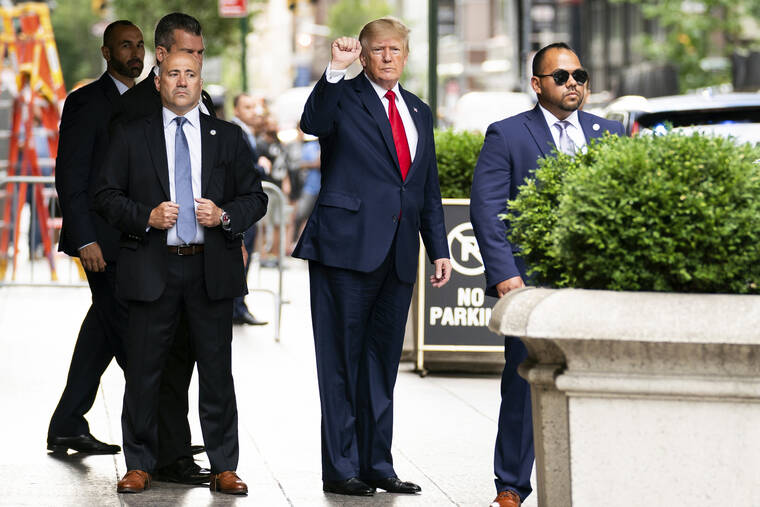 ASSOCIATED PRESS
                                Former President Donald Trump gestures as he departs Trump Tower, Wednesday, in New York, on his way to the New York attorney general’s office for a deposition in a civil investigation.