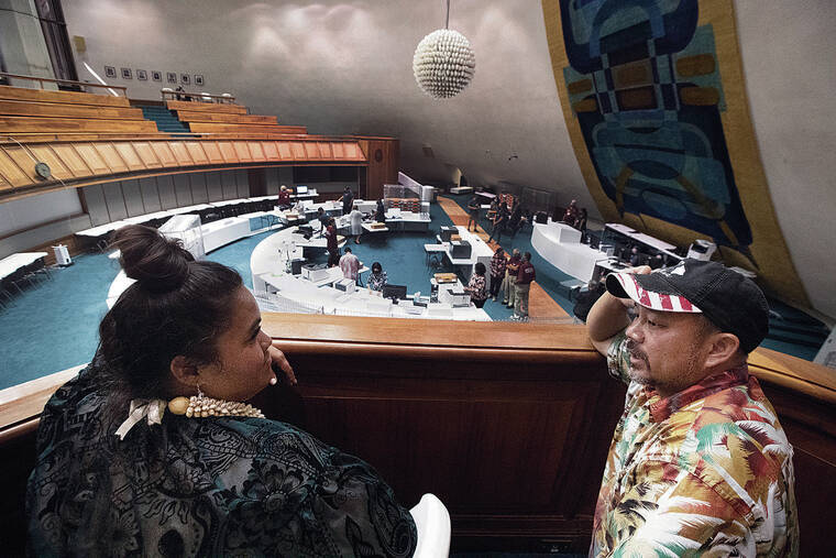 GEORGE F. LEE / GLEE@STARADVERTISER.COM
                                Primary election candidates Tiana Wilbur, left, and Adriel Lam spoke to each other as they watched Monday’s ballot recount on the floor of the state Senate chamber. Both of their close races were part of the automatic recounts.