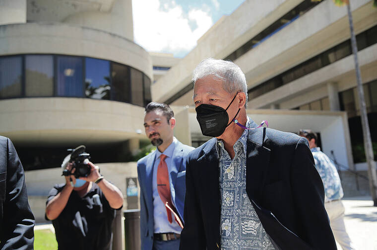 JAMM AQUINO / JUNE 17
                                Former Honolulu Prosecutor Keith Kaneshiro, businessman Dennis Mitsunaga and three other defendants — Aaron Fujii, Chad McDonald and Terri Otani — all pleaded not guilty in their initial appearance in federal court after being indicted on charges of bribery, fraud and conspiracy. Kaneshiro, right, leaves federal court in Honolulu.