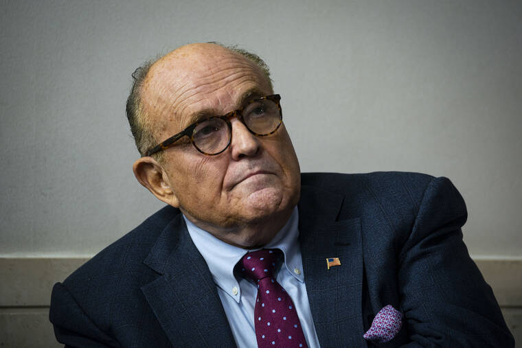 AL DRAGO/THE NEW YORK TIMES
                                Rudy Giuliani, President Donald Trump’s personal lawyer, listens as Trump speaks during a news briefing in the White House in Washington, in September 2020. Lawyers for Rudy Giuliani have been told that he is a target of a criminal investigation in Georgia into election interference by Donald Trump and his advisers, one of Giuliani’s lawyers said today.