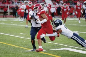 ANDREW LEE / SPECIAL TO THE HONOLULU STAR-ADVERTISER
                                Kahuku’s Kainoa Carvalho rushes with the ball.