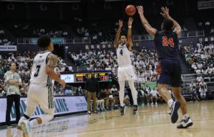 JAMM AQUINO/JAQUINO@STARADVERTISER.COM
                                Hawaii guard Noel Coleman (4) shoots the ball for a three point basket over Cal State Fullerton forward E.J. Anosike (24) during the second half of a men’s NCAA basketball game.