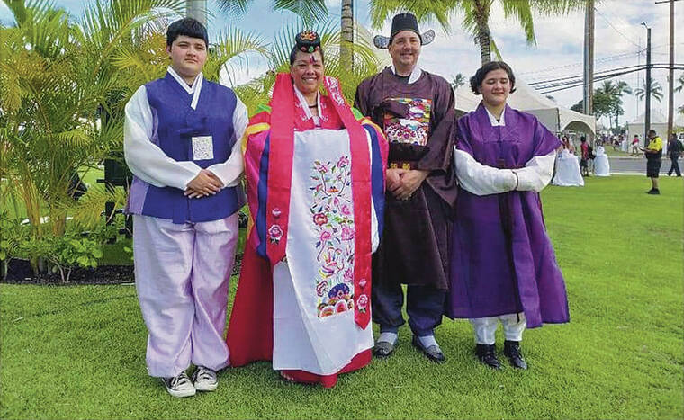 HAWAII KOREAN CHAMBER OF COMMERCE
                                People dressed in traditional Korean outfits. A groom, left, bride and royal officials.
