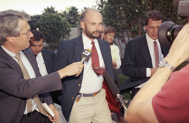 ASSOCIATED PRESS / JULY 25, 1990
                                Former Exxon Valdez Capt. Joseph Hazelwood is surrounded by reporters as he leaves his re-licensing hearing in Long Beach, Calif., in 1990. Hazelwood, who was at the helm of the Exxon Valdez oil tanker when it ran aground more than three decades ago in Alaska, causing one of the worst oil spills in U.S. history, died in July 2022, the New York Times reported. He was 75.