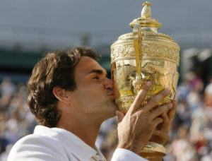 AP PHOTO/ANJA NIEDRINGHAUS, FILE
                                Switzerland’s Roger Federer kisses the trophy after defeating Rafael Nadal to win his fifth consecutive Men’s Singles Championship on the Centre Court at Wimbledon, Sunday July 8, 2007.
