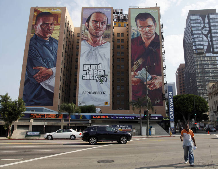 ASSOCIATED PRESS A Grand Theft Auto V billboard is displayed at Figueroa Hotel in September 2013, in Los Angeles. Video game producer Rockstar Games said, today, that early development footage from the next version of its popular title Grand Theft Auto was stolen in the hack of its network.
