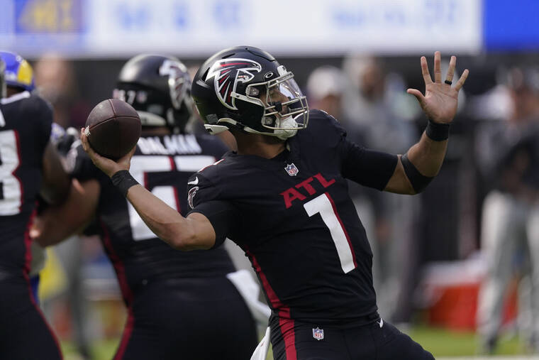 ASSOCIATED PRESS
                                Atlanta Falcons quarterback Marcus Mariota throws a pass on Sunday.