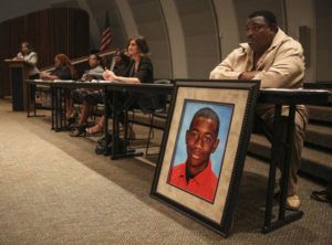 LOREN ELLIOTT/TAMPA BAY TIMES VIA ASSOCIATED PRESS
                                Andrew Joseph Jr. sits behind a picture of his deceased son, Andrew Joseph III, at a Black Lives Matter forum at John Germany Library in Tampa, Fla., in September 2015. A Florida sheriff has been ordered by a jury to pay $15 million to the parents of Andrew Joseph III, a teenager who died while trying to cross a highway after being kicked out of the state fair by deputies. The 10-person jury reached its verdict Thursday.