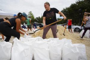 TAMPA BAY TIMES VIA AP
                                Friends Felicia Livengood, 29, and Victoria Colson, 31, fill sandbags along with hundreds of other Tampa, residents that waited for over 2 hours at Himes Avenue Complex to fill their 10 free sandbags today in Tampa, Fla.