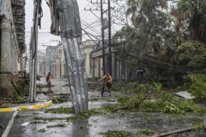 ASSOCIATED PRESS / SEPT. 27
                                Fallen electricity lines, metal and tree branches litter a street after Hurricane Ian hit Pinar del Rio, Cuba, Tuesday, Sept. 27.
