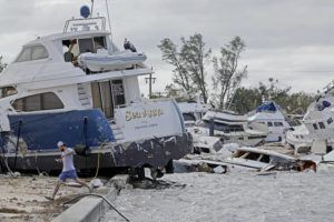 AMY BETH BENNETT/SOUTH FLORIDA SUN-SENTINEL ASSOCIATED PRESS
                                Joe Dalton, on vacation from Cleveland, Ohio, checks out beached boats at Fort Myers Wharf along the Caloosahatchee River, today, in Fort Myers, Fla., following Hurricane Ian.