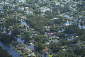 MARTA LAVANDIER / AP
                                Homes are surrounded by flood waters caused by Hurricane Ian, Thursday, Sept. 29, in Fort Myers, Fla.