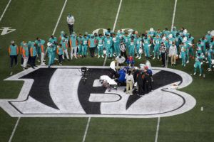 ASSOCIATED PRESS
                                Teammates gather around Miami Dolphins quarterback Tua Tagovailoa after an injury during the first half of an NFL football game against the Cincinnati Bengals, Thursday in Cincinnati.