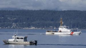 ASSOCIATED PRESS / SEPT. 5
                                A U.S. Coast Guard boat and Kitsap, Wash., County Sheriff boat search the area, Monday, Sept. 5, near Freeland, Wash., on Whidbey Island north of Seattle where a chartered floatplane crashed the day before, killing 10 people.