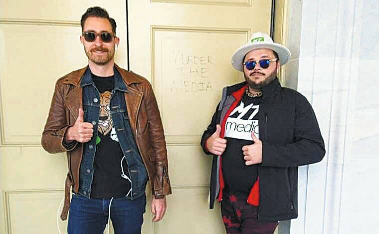 COURTESY U.S. DEPARTMENT OF JUSTICE Proud Boys Hawaii founder Nick Ochs, left, and his alleged accomplice Nicholas DeCarlo pose next to the words Murder the media scrawled in a door of the U.S. Capitol on Jan. 6, 2021.