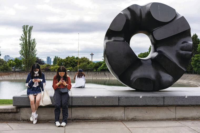 NEW YORK TIMES
                                “Black Sun,” by Isamu Noguchi, is on display outside the Seattle Asian Art Museum.