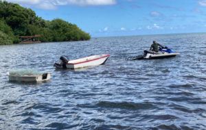 COURTESY HAWAII DEPARTMENT OF LAND AND NATURAL RESOURCES
                                State officers confiscated more than 1,000 feet of lay net and two small boats from a man in Kaneohe Bay, Friday, Sept. 23.