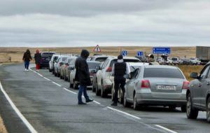 ASSOCIATED PRESS
                                People walk next to their cars queuing to cross the border into Kazakhstan at the Mariinsky border crossing, about 250 miles south of Chelyabinsk, Russia, today. Officials say over 194,000 Russians have crossed into Georgia, Kazakhstan and Finland in the week since President Vladimir Putin announced a partial mobilization of reservists to fight in Ukraine.