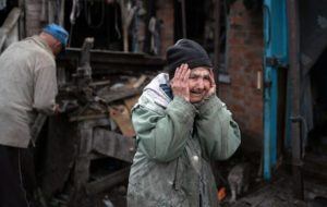 ASSOCIATED PRESS
                                Valentina Bondarenko reacts as she stands with her husband Leonid outside their house that was heavily damaged after a Russian attack in Sloviansk, Ukraine, today. The 78-year-old woman was in the garden and fell on the ground at the moment of the explosion. “Everything flew and I started to run away”, says Valentina.