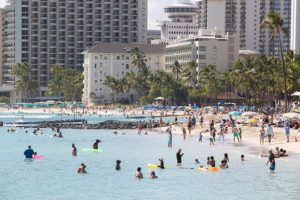 CINDY ELLEN RUSSELL / AUG. 2
                                Tourists enjoy the waters of Waikiki Beach in August. State officials said today that 829,699 visitors came to Hawaii in August, down more than 10% from August 2019.