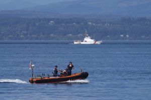 ASSOCIATED PRESS / SEPT. 5
                                A pair of U.S. Coast Guard vessels search the area, Monday, Sept. 5, near Freeland, Wash., on Whidbey Island north of Seattle where a chartered floatplane crashed the day before. The plane was carrying 10 people and was en route from Friday Harbor, Wash., to Renton, Wash.
