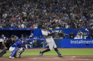 THE CANADIAN PRESS VIA AP
                                New York Yankees’ Aaron Judge hits a two-run home run, his 61st homer of the season, next to Toronto Blue Jays catcher Danny Jansen during the seventh inning today.