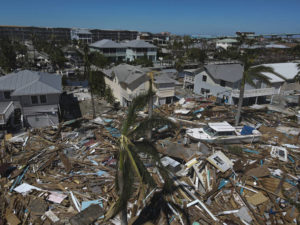 ASSOCIATED PRESS
                                In this photo taken with a drone, debris from destroyed buildings swept from the beachfront lies amid damaged homes, two days after the passage of Hurricane Ian in Fort Myers Beach, Fla., on Friday.