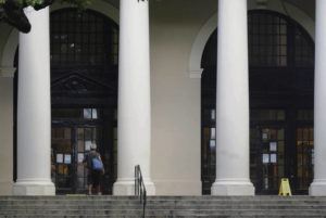 JAMM AQUINO / JAQUINO@STARADVERTISER.COM
                                An “unspecified threat” Monday caused the closure of the state’s public libraries. A man walked toward the locked front doors of the Hawaii State Library.