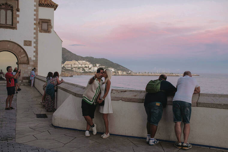 NEW YORK TIMES
                                Visitors at the Plaça del Baluard, the entrance to the old town in Sitges, Spain.
