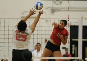 BRUCE ASATO / BASATO@STARADVERTISER.COM
                                Iolani’s Saige Kaahaaina-Torres hits past Waianae’s Alexus Kapihe in the third set of the Waianae vs Iolani girls’ volleyball match in the first round of the HHSAA Division I Girls Volleyball Tournament at Iolani Gym, Monday, October 23, 2017.