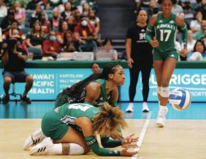 JAMM AQUINO/JAQUINO@STARADVERTISER.COM
                                Hawaii middle blocker Amber Igiede (3), top, and defensive specialist Talia Edmonds (13) come up short on a dig against the USC Trojans during the second set of an NCAA women’s volleyball game in Honolulu.