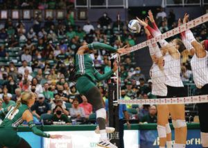 JAMM AQUINO / JAQUINO@STARADVERTISER.COM
                                Hawaii’s Amber Igiede was blocked by USC opposite Emilia Weske, third from right, middle blocker Lindsey Miller and outside hitter Skylar Fields on Friday.