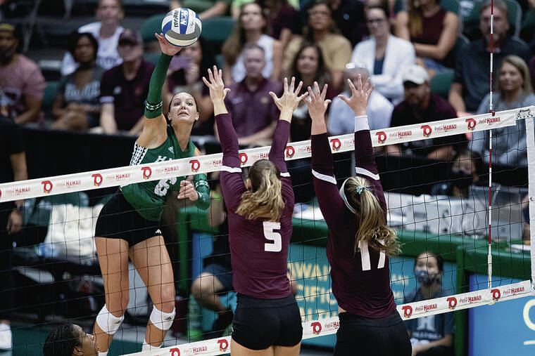 GEORGE F. LEE / GLEE@STARADVERTISER.COM
                                University of Hawaii Wahine Riley Wagoner was on a cross court kill attempt against Texas State Bobcats Tessa Marshall and Emily DeWalt in a volleyball game at the SimpliFi Arena at the Stan Sheriff Center.