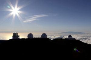 ASSOCIATED PRESS
                                The sun sets behind telescopes at the summit of Maunakea on Big Island.