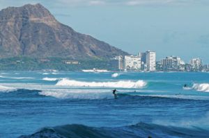 JAMM AQUINO/JAQUINO@STARADVERTISER.COM
                                Surfers ride large waves on Monday in Honolulu.
