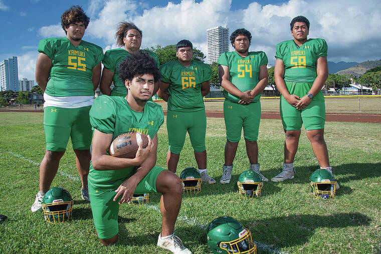 CRAIG T. KOJIMA / CKOJIMA@STARADVERTISER.COM
                                Ofa Vehikite has found running room behind Kaimuki’s offensive line, which includes Harmon Sio, left, Champ Wells, Freddy Welly, Christopher Taufa and Eric McFall. Another member not pictured is center To’osavili Agae-Naipo.