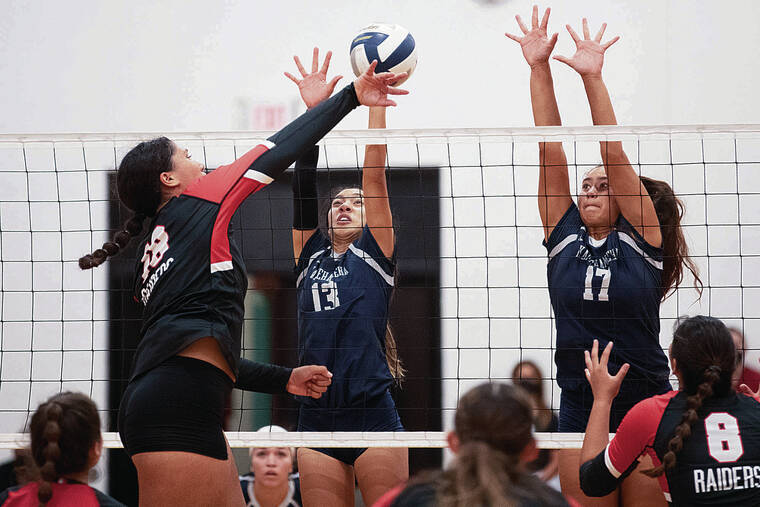 GEORGE F. LEE / GLEE@STARADVERTISER.COM
                                Kamehameha’s Charlize Ching, left, and Adrianna Arquette put up a block against ‘Iolani’s Senna Roberts-Navarro during an ILH girls volleyball match Tuesday at ‘Iolani gym.