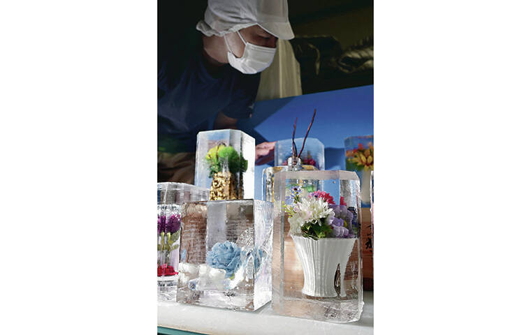 JAPAN NEWS-YOMIURI
                                Ornamental ice blocks, with vivid artificial flowers suspended in the ice, are on display at Onoda-Shoten Co.’s factory in Tokyo.