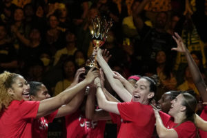 ASSOCIATED PRESS
                                Players from the United States celebrate with with their trophy after defeating China in their gold-medal game.