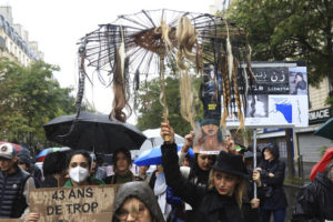 ASSOCIATED PRESS
                                Protesters march, one holding an umbrella with fake hair, during a demonstration to show support for Iranian protesters standing up to their leadership over the death of a young woman in police custody in Paris. Thousands of Iranians have taken to the streets over the last two weeks to protest the death of Mahsa Amini, a 22-year-old woman who had been detained by Iran’s morality police in the capital of Tehran for allegedly not adhering to Iran’s strict Islamic dress code.