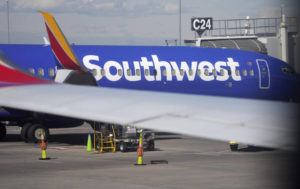 ASSOCIATED PRESS / 2021
                                A Southwest Airlines jetliner sits at a gate on the C concourse of Denver International Airport in Denver. A Southwest Airlines pilot is suing the company, her union and a former colleague who pleaded guilty last year to stripping naked in front of her during a flight.