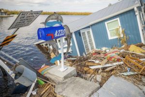 THE NEWS -PRESS / AP
                                A residence sits partially submerged in water after Hurricane Ian leaves behind widespread damage across Pine Island, Fla., on Tuesday, Oct. 4.