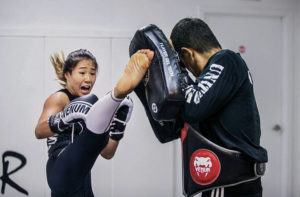 STAR-ADVERTISER
                                Angela Lee working out with her strike coach, Haru Shimanishi.
