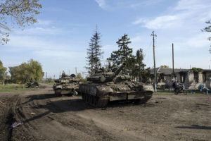 EVGENIY MALOLETKA / AP
                                Abandoned Russian tanks stand on the road in recently liberated town Kupiansk, Ukraine, Saturday, Oct. 1.