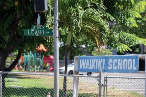 CINDY ELLEN RUSSELL / CRUSSELL@STARADVERTISER.COM
                                Pictured is a detail of the Leahi Avenue sign with Waikiki Elementary School signage behind it.