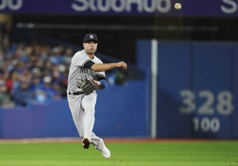 THE CANADIAN PRESS VIA AP New York Yankees shortstop Isiah Kiner-Falefa throws to first for the out on Toronto Blue Jays Raimel Tapia on Tuesday.