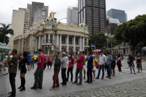 ASSOCIATED PRESS
                                People line up to vote during the general election, in Rio de Janeiro, Brazil.